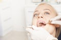 Dentist hands working with female teeth Royalty Free Stock Photo