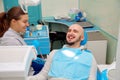 Dentist having fun with patient during treatment Royalty Free Stock Photo