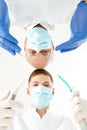 Dentist and his assistant holding instruments Royalty Free Stock Photo