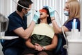 Dentist and his assitant working in private practice Royalty Free Stock Photo