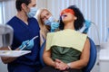 Dentist and his assitant working in private practice Royalty Free Stock Photo