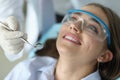 Dentist hold in hand mirror ready to examine female patient Royalty Free Stock Photo