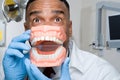 Dentist holding false teeth