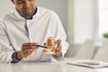 Dentist holding jaw model, showing what correct teeth position is and teaching how to clean them