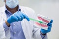 Dentist holding a mouth model and tooth brush