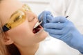 Dentist identifying cavities in mouth of patient Royalty Free Stock Photo