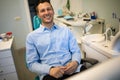 Dentist Inspecting Teeth Of Young Man.