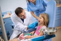 Dentist look teeth of young girl in dental ambulance Royalty Free Stock Photo