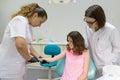 Dentist makes an injection in the hand, checks the reaction of the body to anesthetic preparations