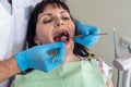 The dentist makes patients prophylactic examination