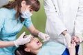 Dentist making anaesthetic injection to female Royalty Free Stock Photo