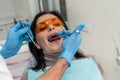 Dentist making injection of anesthetic to patient