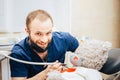 Dentist a man with a teddy bear in the form of a patient in a chair. Royalty Free Stock Photo