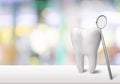 Big tooth and dentist mirror in dentist clinic on Royalty Free Stock Photo