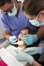 Dentist And Nurse Giving Girl Check Up