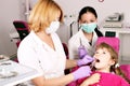 Dentist nurse and little girl patient