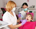 Dentist nurse and little girl patient