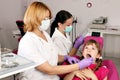 Dentist nurse and little girl patient