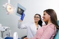 Dentist / nurse showing dental scan Royalty Free Stock Photo