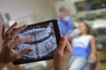 Dentist Office-Digital tablet with a patients x-rays Royalty Free Stock Photo