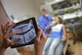 Dentist Office-Digital tablet with a patients x-rays Royalty Free Stock Photo