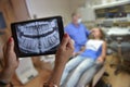 Dentist Office-Digital tablet with a patients x-rays