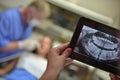 Dentist Office-Digital tablet with a patients x-rays Royalty Free Stock Photo