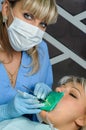 Dentist with patient, cleaning and curing