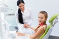 Dentist and Patient in Dentist Office. Child in the Dental Chair Royalty Free Stock Photo
