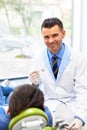 Dentist and Patient in Dentist Office. Young Man in the Dental C Royalty Free Stock Photo