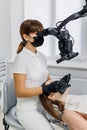 Dentist with patient during teeth examination with microscope. Modern dental clinic. Concept of innovative equipment in oral