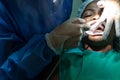 Dentist performing dental treatment procedure at the dental clinic