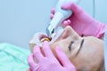 Dentist in pink glove scanning teeth with 3d scanning machine