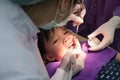 Dentist polishing asian girls teeth. Royalty Free Stock Photo