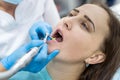 Dentist polishing patient`s teeth after whitening procedure Royalty Free Stock Photo