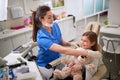 Dentist prepares patient for tooth repair