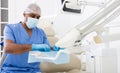 Dentist preparing special medical tools in dental office