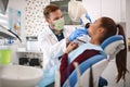 Dentist preparing X-ray apparatus to make a dental footage Royalty Free Stock Photo