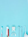 Dentist Professional tools medical equipment toothbrush, toothpaste and Tooth model on Blue background. Dental Hygiene and Health Royalty Free Stock Photo