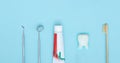 Dentist Professional tools medical equipment toothbrush, toothpaste and Tooth model on Blue background. Dental Hygiene and Health Royalty Free Stock Photo
