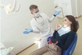 dentist proves to the patient that harmful products spoil her teeth Royalty Free Stock Photo