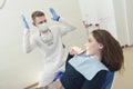 dentist proves to the patient that harmful products spoil her teeth Royalty Free Stock Photo