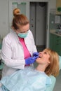 Dentist puts dental veneers patient Royalty Free Stock Photo