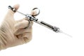 Dentist`s hand with carpool syringe for local anesthesia on white background