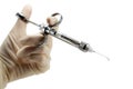 dentist`s hand with carpool syringe for local anesthesia on white background