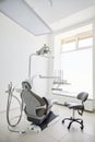 Dentist\'s office interior with modern chair and special dentist equipment. Dentist chair in high class dental