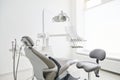 Dentist\'s office interior with modern chair and special dentist equipment. Dentist chair in high class dental