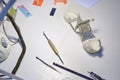 Dentist`s tools and a dental impression on the table of the prosthetist`s doctor