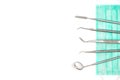 Dentist`s tools and mask on white background. Royalty Free Stock Photo