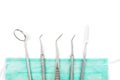 Dentist`s tools and mask on white background. Royalty Free Stock Photo